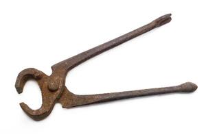 Old rusty pliers, isolated on white background, top view photo