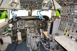 close up shot on helicopter console inside cockpit. Levers, parts and control buttons in the cockpit of an aircraft. photo