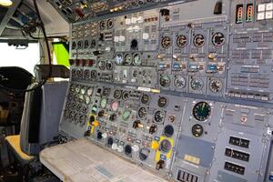 close up shot on helicopter console inside cockpit. Levers, parts and control buttons in the cockpit of an aircraft. photo