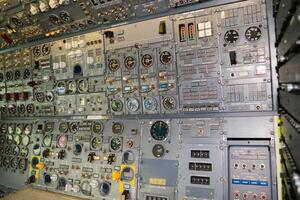 close up shot on helicopter console inside cockpit. Levers, parts and control buttons in the cockpit of an aircraft. photo