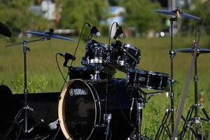 Russia, St. Petersburg June 25, 2022 set of drums, cymbals and other percussion instruments on stage photo
