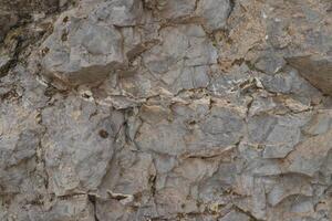 Rough rock and stone surface texture photo