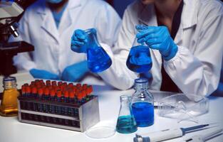 professional chemist woman laboratory using scientific microscope for science research, chemistry scientist with microbiology medicals equipment technology to working with medicine biology experiment photo