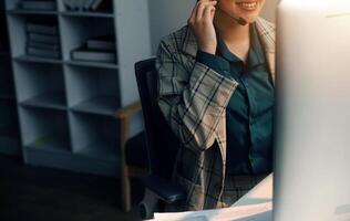 Call center, computer and business with woman in office for customer service, technical support and advice. Technology, contact us and communication with employee operator in help desk agency photo