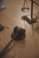 Judge gavel with Justice lawyers having team meeting at law firm background. Concepts of Law and Legal services. photo