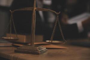 Judge gavel with Justice lawyers having team meeting at law firm background. Concepts of Law and Legal services. photo