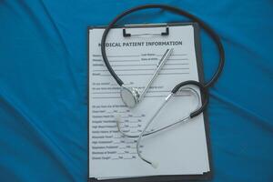 In a hospital setting, the presence of a doctor's physician book and stethoscope carries with it an air of professionalism and dedication to patient care. photo