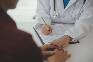 Female doctors shake hands with patients encouraging each other To offer love, concern, and encouragement while checking the patient's health. Concept Health care and Social Security photo