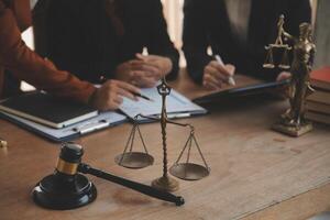 Lawyer, legal advisor, businessman brainstorming information on agreement details Business contracts in legal processing books for accuracy in contract documents. joint financial investment. photo