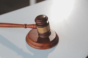 Law theme, gavel or mallet of the judge, lawyer enforcement officers, evidence-based cases taken into account in the court abount business, legislation. photo
