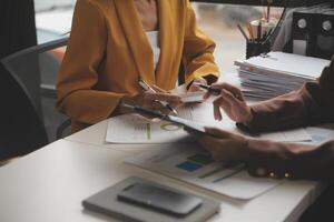 Team of business people working together in the meeting room office, teamwork background charts and graphs banner, double exposure successful teamwork,business planning concept. photo
