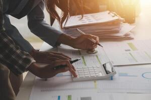 Team of business people working together in the meeting room office, teamwork background charts and graphs banner, double exposure successful teamwork,business planning concept. photo