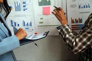 Team of business people working together in the meeting room office, teamwork background charts and graphs banner, double exposure successful teamwork,business planning concept. photo