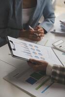 Team of business people working together in the meeting room office, teamwork background charts and graphs banner, double exposure successful teamwork,business planning concept. photo