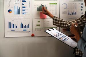 Team of business people working together in the meeting room office, teamwork background charts and graphs banner, double exposure successful teamwork,business planning concept. photo