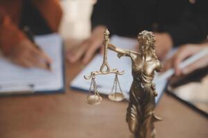 Lawyer, legal advisor, businessman brainstorming information on agreement details Business contracts in legal processing books for accuracy in contract documents. joint financial investment. photo