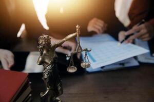 Lawyer, legal advisor, businessman brainstorming information on agreement details Business contracts in legal processing books for accuracy in contract documents. joint financial investment. photo