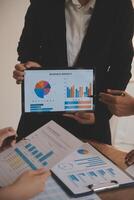 Business people are analyzing and planning business strategies. photo