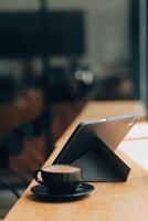 Coffee Cup on the Table with Computer Keyboard for Business Concept. photo