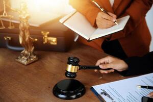 Lawyer, legal advisor, businessman brainstorming information on agreement details Business contracts in legal processing books for accuracy in contract documents. joint financial investment. photo