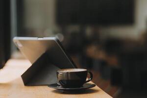 Coffee Cup on the Table with Computer Keyboard for Business Concept. photo