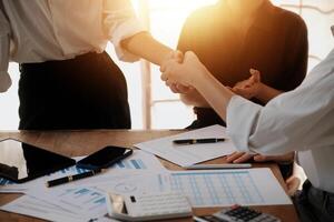 Leaders of business organizations join hands after the meeting is complete. Business partner meeting ideas. photo