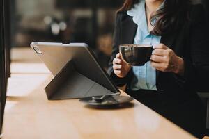 Coffee Cup on the Table with Computer Keyboard for Business Concept. photo