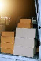 Asian delivery express courier young man use giving boxes to woman customer he wearing protective face mask at front home photo