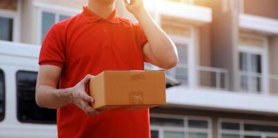 Asian delivery express courier young man use giving boxes to woman customer he wearing protective face mask at front home photo