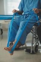 A physiotherapist doing treatment with patient in bright office photo