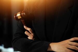 Law theme, gavel or mallet of the judge, lawyer enforcement officers, evidence-based cases taken into account in the court abount business, legislation. photo