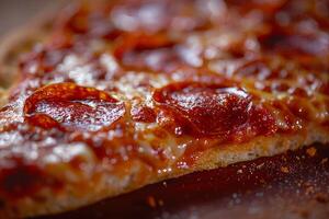 Pepperoni pizza on a wooden background. Close-up. photo