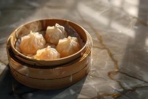 Chinese dim sum dumplings in bamboo steamer photo