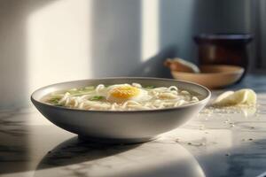 Kalguksu. Bowl of tasty korean noodles with vegetables on table, closeup photo