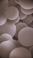 Vertical - gently moving warm shaded spheres abstract background. This soothing relaxing geometric shapes animation is full HD and a seamless loop. video