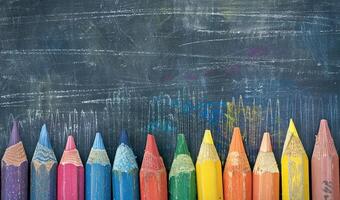 Colorful Crayons on Blackboard Background with Artistic Chalk Marks and Patterns photo