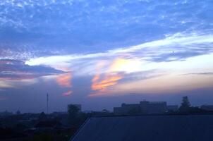 Dramatic morning or evening sky with unique cloud shapes photo