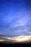 Dramatic morning or evening sky with unique cloud shapes photo