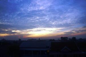 Dramatic morning or evening sky with unique cloud shapes photo
