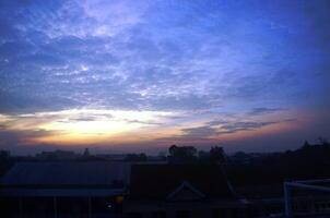 Dramatic morning or evening sky with unique cloud shapes photo
