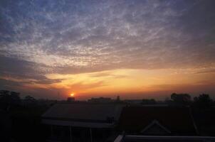 Dramatic morning or evening sky with unique cloud shapes photo