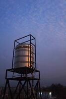 home water tower, Stainless steel water tank on the roof of the building photo