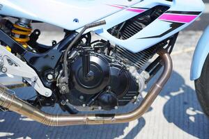 close up of a 4-Stroke underbone category motorbike engine photo