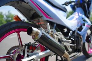 closeup, 4-Stroke underbone motorcycle racing exhaust photo