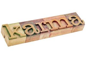 karma word in wood type photo