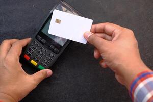 Payment terminal charging from a card, close up photo