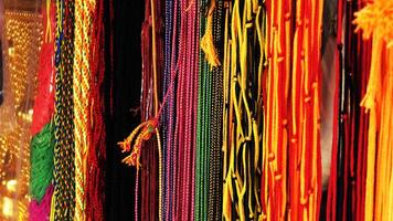 Colorful thread strings used for spiritual purposes displayed in a shop photo