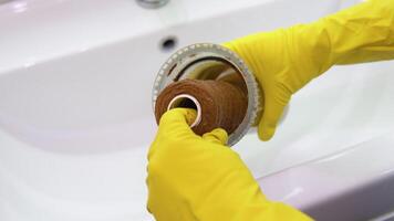 Plumber working replaceable dirty used water filter for filtration of reverse osmosis water video
