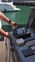 Close-up of the captain's hands at the helm. He controls the movement of the yacht. S video