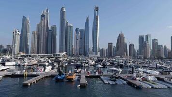 View of the marina with yachts with the Dubai in the background. View from a motor boat. video